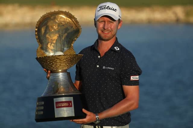 Justin Harding shows off the Mother of Pearl trophy in Doha. Picture: Getty