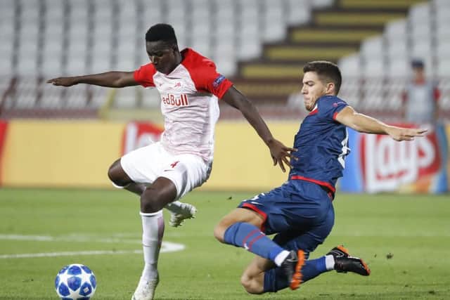 Srdjan Babic sliding in on Amadou Haidara during a Champions League qualifier between Red Star and Red Bull Salzburg. Picture: Getty