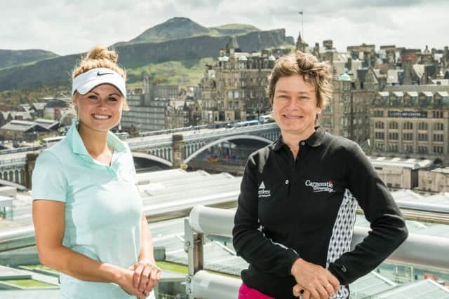 Carly Booth, pictured with Catriona Matthew in Edinburgh in 2013, is determined to make the Scot's Solheim Cup team at Gleneagles in September. Picture: Ian Georgeson