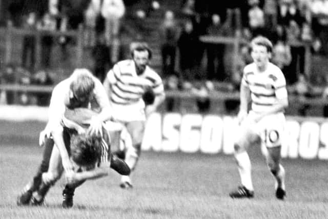 Aberdeens Gordon Strachan is attacked by a fan who ran on to the pitch during a match against Celtic at Parkhead in November 1980