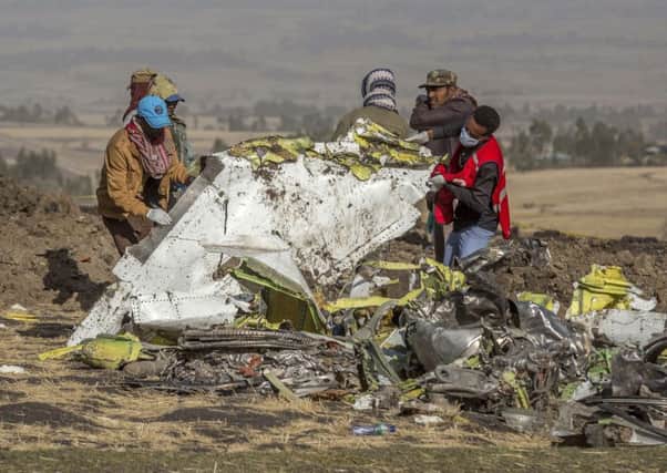 Rescuers work at the scene of an Ethiopian Airlines flight crash. Picture: AP Photo/Mulugeta Ayene