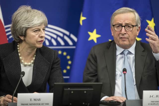 Theresa May and European Commission President Jean-Claude Juncker (Picture: Jean-Francois Badias/AP)