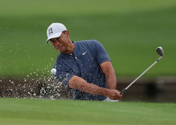 Tiger Woods plays out the bunker during a practice round for The Players Championship. Picture: Richard Heathcote/Getty Images