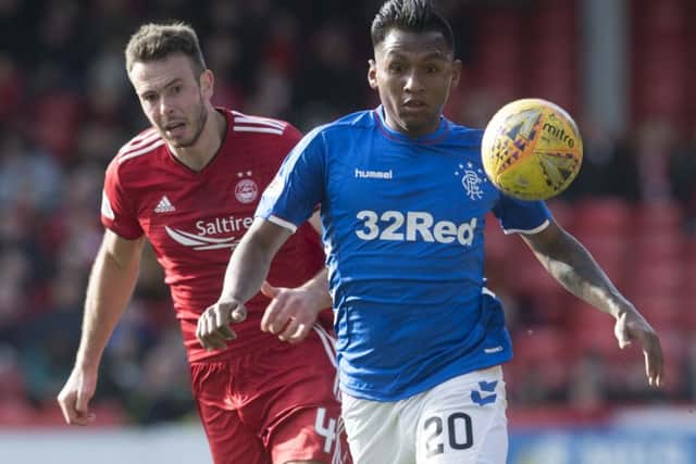 Alfredo Morelos will come up against Andrew Considine at Ibrox this evening. Picture: SNS Group