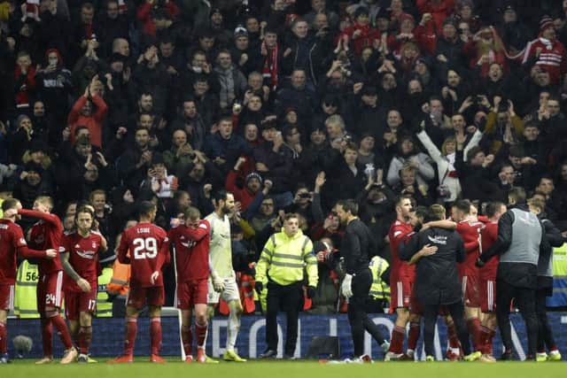 Aberdeen's players celebrate with their fans after knocking Rangers out of the Scottish Cup. Picture: SNS Group