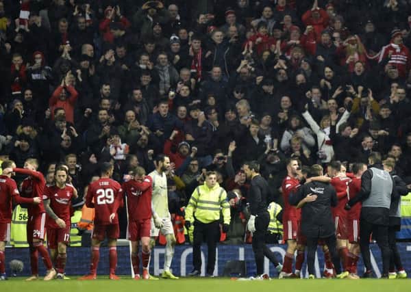 Aberdeen's players celebrate with their fans after knocking Rangers out of the Scottish Cup. Picture: SNS Group