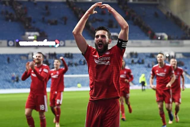 Captain Graeme Shinnie leads the celebrations as Aberdeen knock Rangers out of the Scottish Cup. Picture: SNS Group