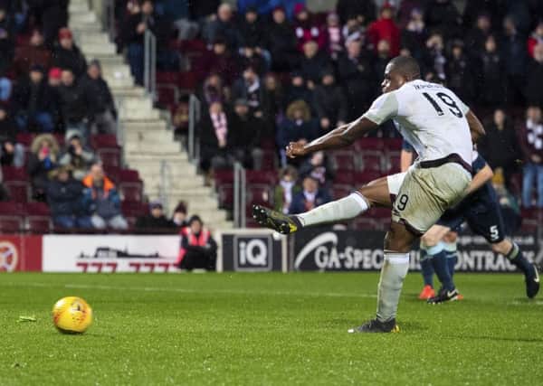 Hearts' Uche Ikpeazu saw his penalty saved by Partick Thistle keeper Conor Hazard. Picture: SNS