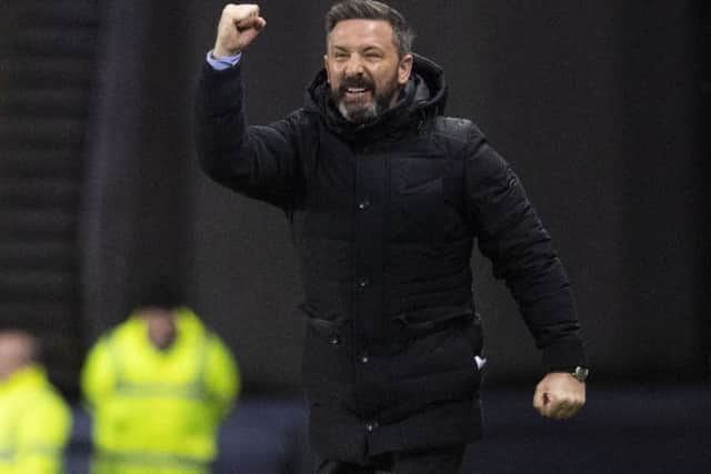 Derek McInnes celebrates as Aberdeen record their third win of the season over Rangers in Glasgow. Picture: SNS Group