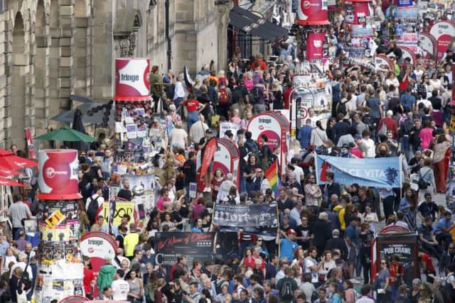 The crowd on Edinburgh's Royal Mile during the Edinburgh Fringe Festival. Picture: Jane Barlow / PA
