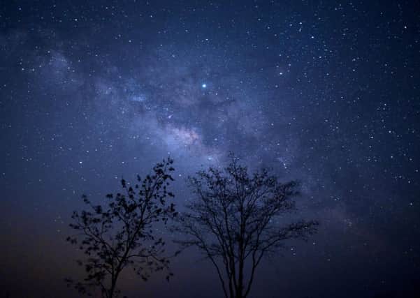 The Milky Way, the galaxy that contains the Earth, holds many mysteries  (Picture: Ye Aung Thu/AFP/Getty Images)