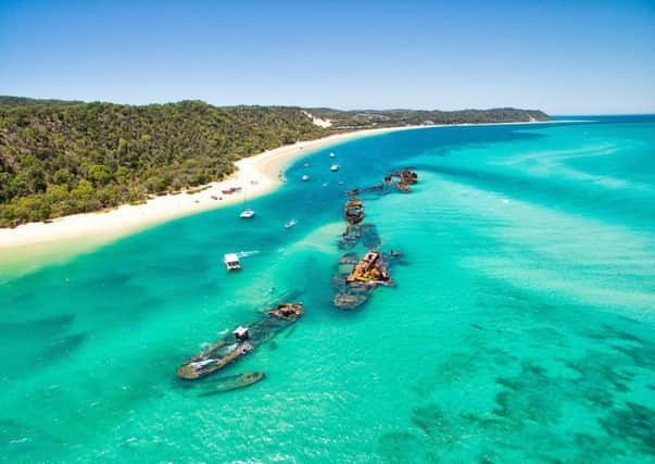 A number of sunken ships at Moreton Island off the coast of Brisbane in Queensland, Australia. These shipwrecks are located just north of Tangalooma Island Resort.