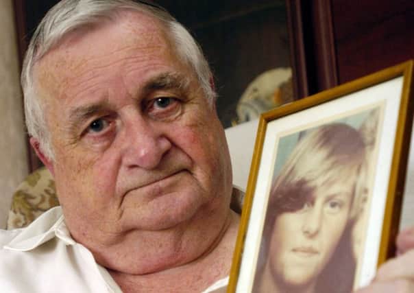 Morain Scott with a photograph of his murdered daughter Helen Scott (Picture: Danny Lawson)