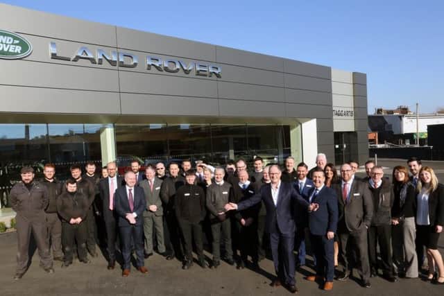 Lookers CEO Andy Bruce with the team at a Taggarts outlet. Picture: Stewart Robertson