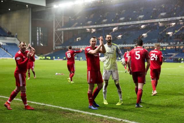 Aberdeen players celebrate the cup win at Ibrox. Picture: Robert Perry/PA Wire
