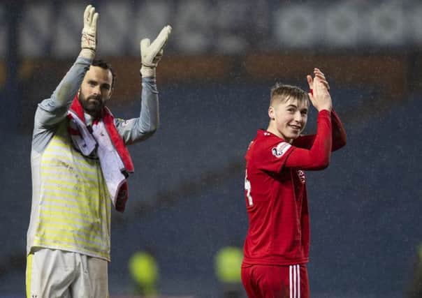 Aberdeen's Joe Lewis (left) with Dean Campbell celebrate beating Rangers to reach the Scottish Cup semi-finals. Picture: SNS