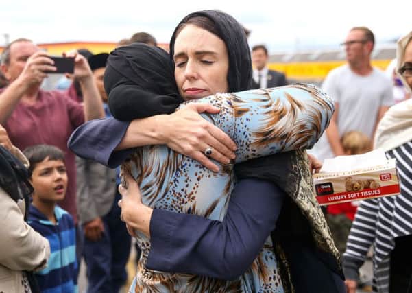 Jacinda Ardern hugs a mosque-goer at the Kilbirnie Mosque in Wellington after the worst mass shooting in New Zealands history (Picture: Hagen Hopkins/Getty)