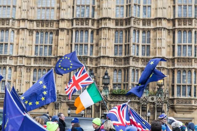 Pro-Brexit and anti-Brexit protesters continue to gather in Westminster as they await the vote on whether Brexit will be delayed. Picture: Getty