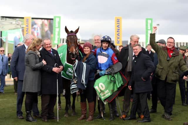 Owner Andrew Gemmell, third from left, with Paisley Park and jockey Aidan Coleman in the winners enclosure after victory in the Stayers Hurdle at Cheltenham. Picture: PA.