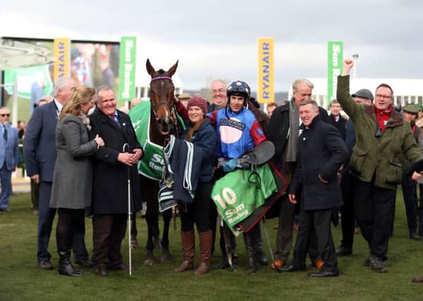 Owner Andrew Gemmell, third from left, with Paisley Park and jockey Aidan Coleman in the winners enclosure after victory in the Stayers Hurdle at Cheltenham. Picture: PA.