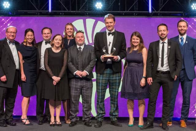 Rory Colville, tournament director of the Aberdeen Standard Invesments Scottish Open, receives the award along with other members of the team involved in the event