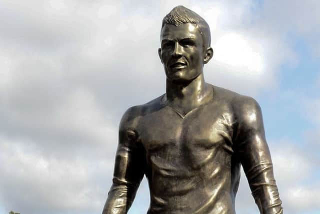 Cristiano Ronaldo seems happy with his likeness cast in bronze in Madeira; women are often photographed groping it, causing the sensitive area to change colour. Picture: AFP/Getty Images)