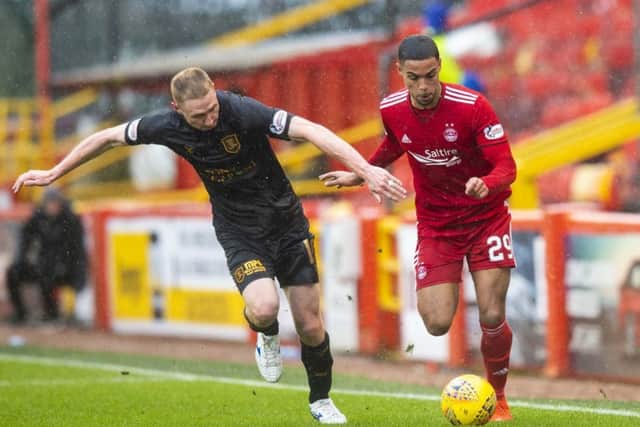 Aberdeen's Max Lowe competes with Chris Erskine. Picture: SNS Group