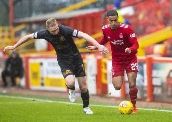 Aberdeen's Max Lowe competes with Chris Erskine. Picture: SNS Group