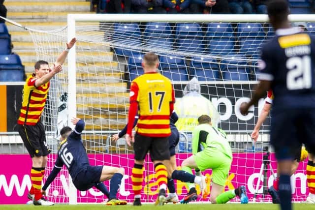 Falkirk's Ian McShane (L) scores to make it 1-1