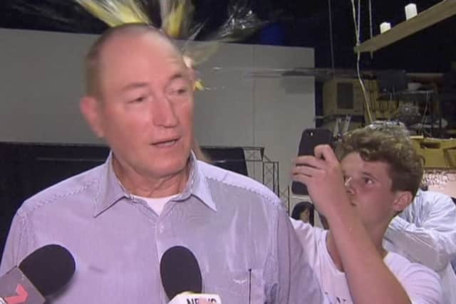 Teenager Will Connolly breaks an egg on the head of Senator Fraser Anning while he holds a press conference. Picture: AP Photo