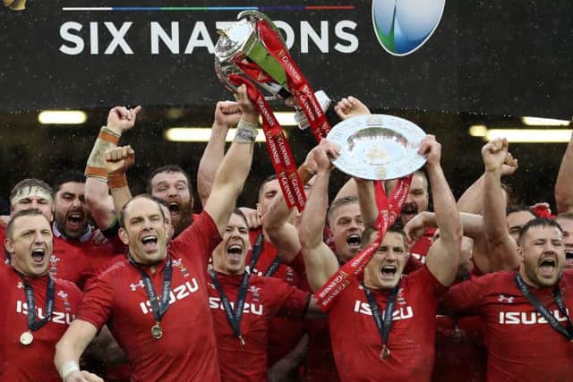 Alun Wyn Jones holds the Six Nations trophy high after Wales win over Ireland on Saturday. Picture: PA.