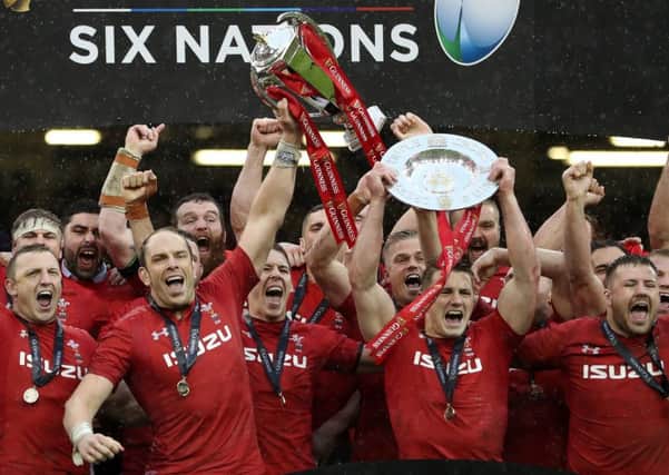Alun Wyn Jones holds the Six Nations trophy high after Wales win over Ireland on Saturday. Picture: PA.