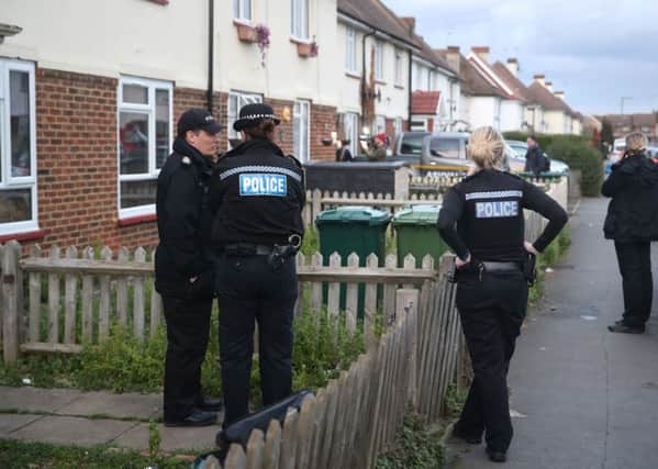 Police in Viola Avenue in Surrey where they are investigating a stabbing in which a man rampaged with a baseball bat and knife while hurling racist abuse. Picture: Steve Parsons/PA Wire