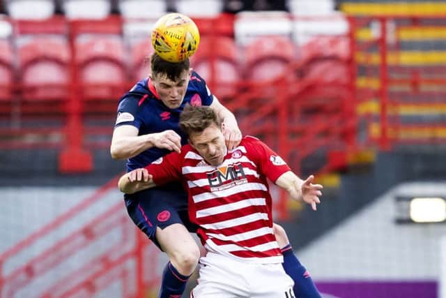Hearts' John Souttar outjumps David McMillan of Hamilton for a header. Picture: SNS.