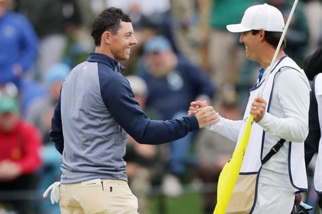 Rory McIlroy celebrates with his caddie Harry Diamond after holing the winning putt in the Players Championship at Sawgrass. Picture: Getty