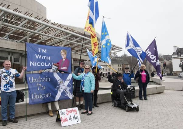 IndyRef 2 campaigners gather outside the Scottish Parliament. Picture: Andrew O'Brien