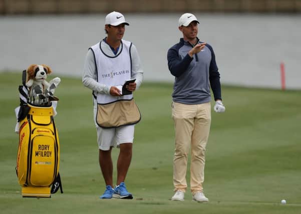 Rory McIlroy with caddy Harry Diamond during his triumphant final round at The Players Championship. Picture: Richard Heathcote/Getty