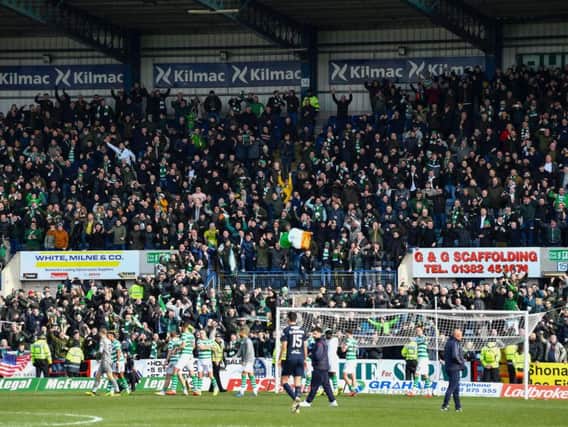 Celtic fans celebrate victory over Dundee. Picture: SNS
