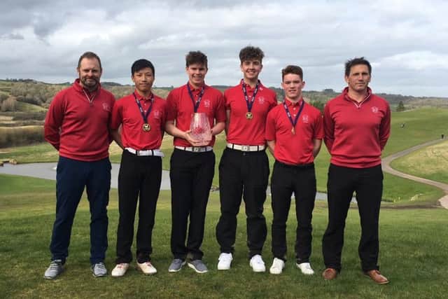 Loretto's trimphant team with head of golf coaching Ian Muir, far left, and director of golf Rick Valentine, far right