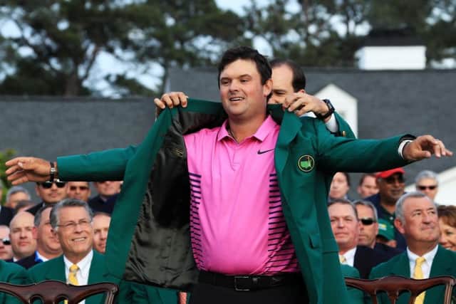 Patrick Reed is awarded the Green Jacket by 2017 winner Sergio Garcia.  Picture: David Cannon/Getty Images