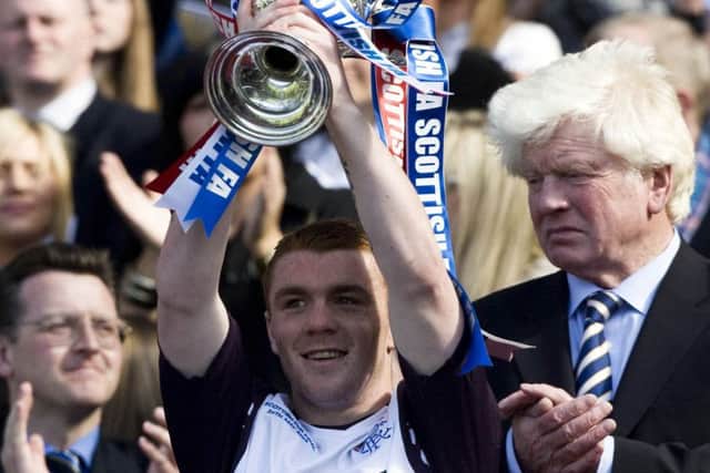 John Fleck lifts the Scottish Cup after Rangers' 3-2 win over Queen of the South at Hampden in 2008.