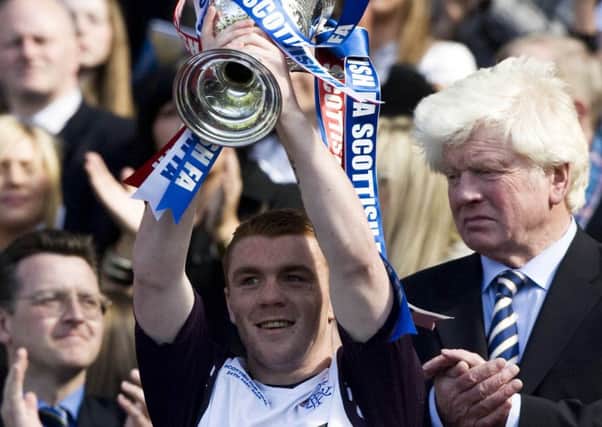 John Fleck lifts the Scottish Cup after Rangers' 3-2 win over Queen of the South at Hampden in 2008.