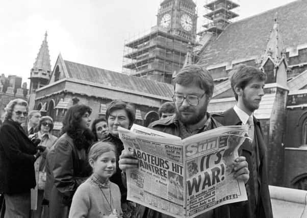 Topical reading in the queue waiting for the public gallery to open at the Houses of Parliament when MPs sat in session for the first time on a Saturday morning since the Suez crisis, following the invasion of the Falkland Islands by Argentina in 1982.