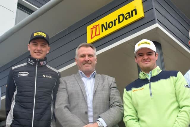 Sam Locke, left, and Craig Lawrie, right, with Alex Brown, NorDan UK's managing director