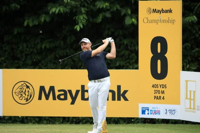 Stephen Gallacher on his way to a first-round 74 in the Maybank Championship. Picture: Getty Images
