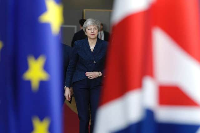 Theresa May arrives in Brussels on the first day of an EU summit focused on Brexit (Picture: Aris Oikonomou/AFP/Getty)