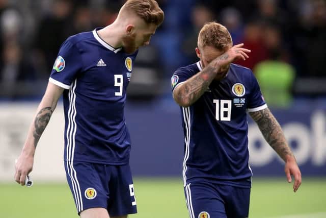Striker Oli McBurnie, left, was an isolated figure up front and was eventually replaced by Johnny Russell, right. Picture: Adam Davy/PA Wire