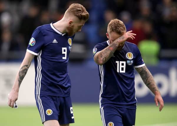 Striker Oli McBurnie, left, was an isolated figure up front and was eventually replaced by Johnny Russell, right. Picture: Adam Davy/PA Wire