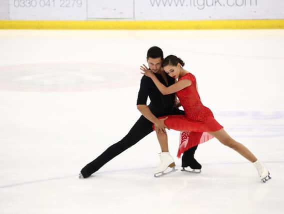 Lewis Gibson, pictured with partner Lilah Fear, said he was pleased with the couple's score in the rhythm dance in Japan.