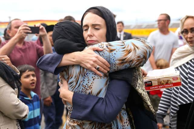 New Zealand Prime Minister Jacinda Ardern hugs a mosque-goer. Picture: Hagen Hopkins/Getty Images